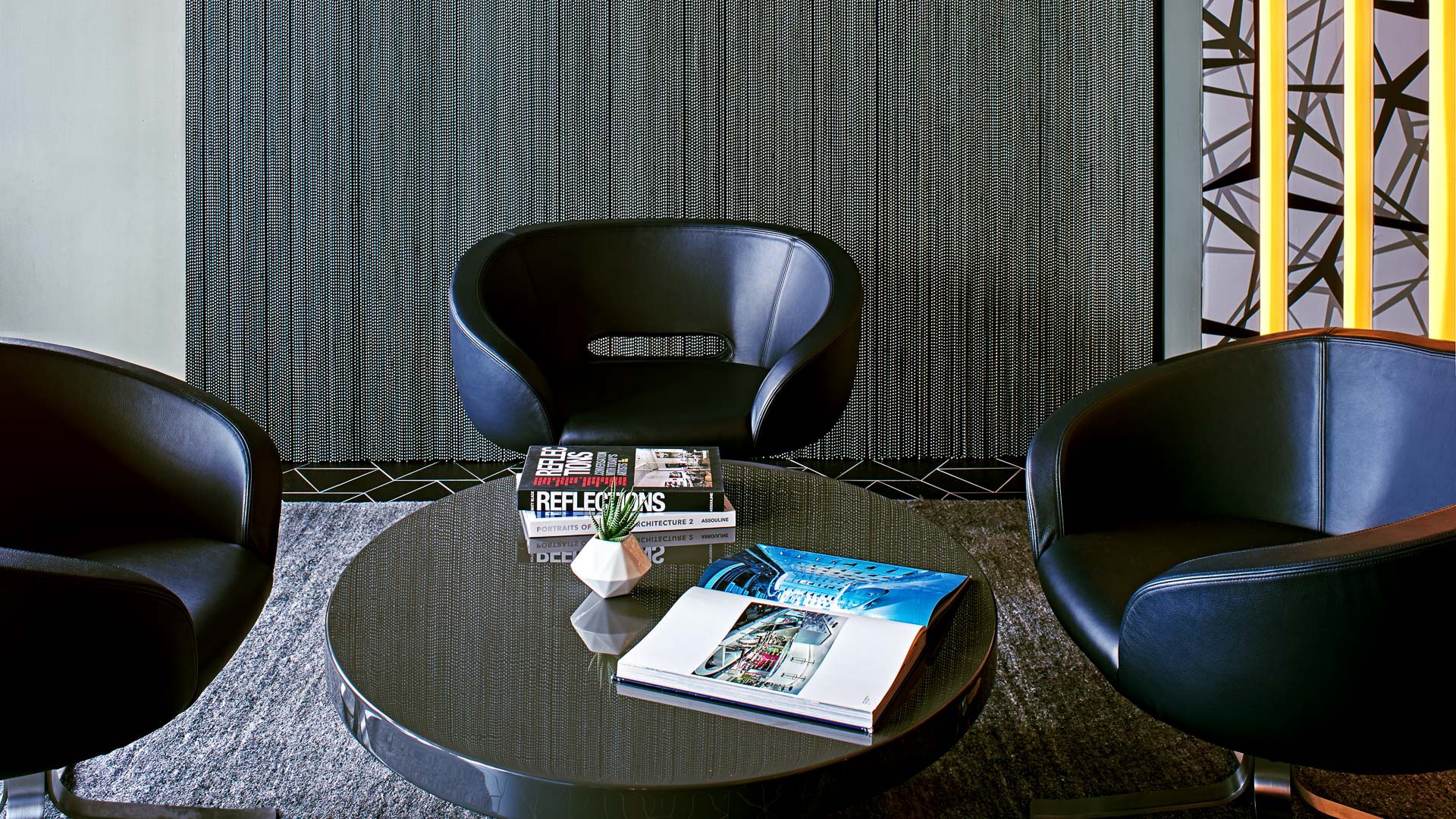 a table with books and a plant on it