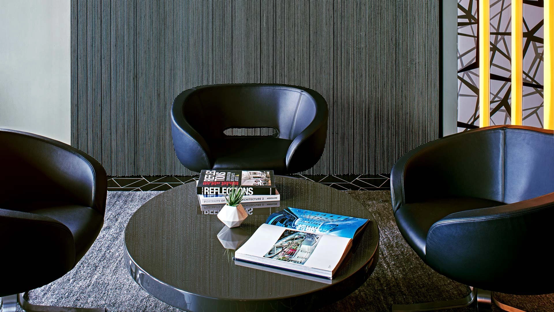a table with books and a plant on it