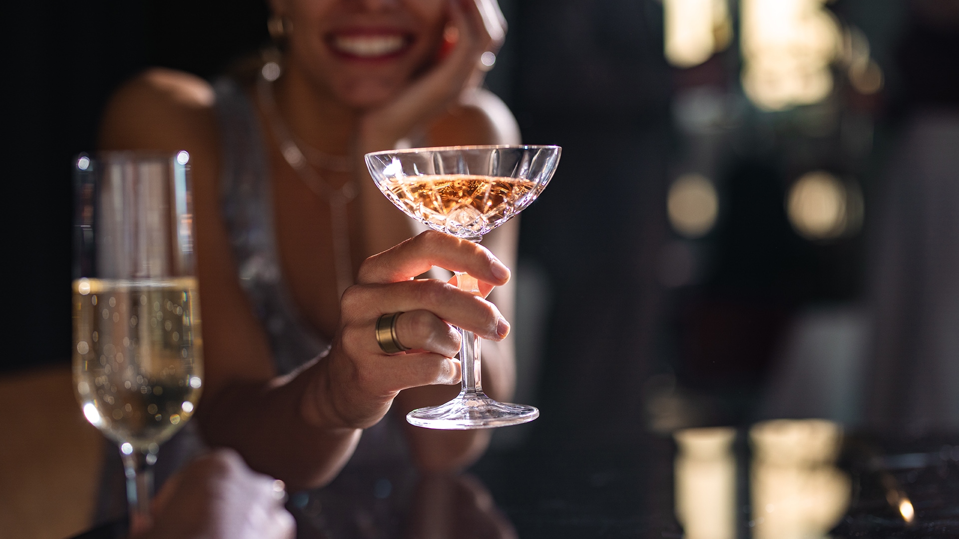 a woman holding a glass of wine