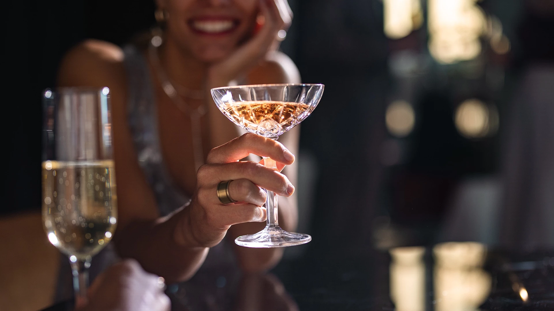 a woman holding a glass of wine