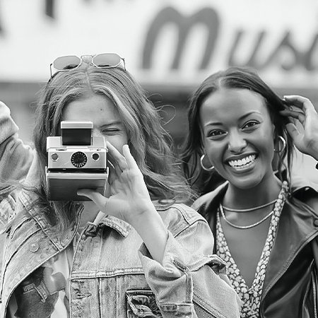 a woman taking a picture with a camera