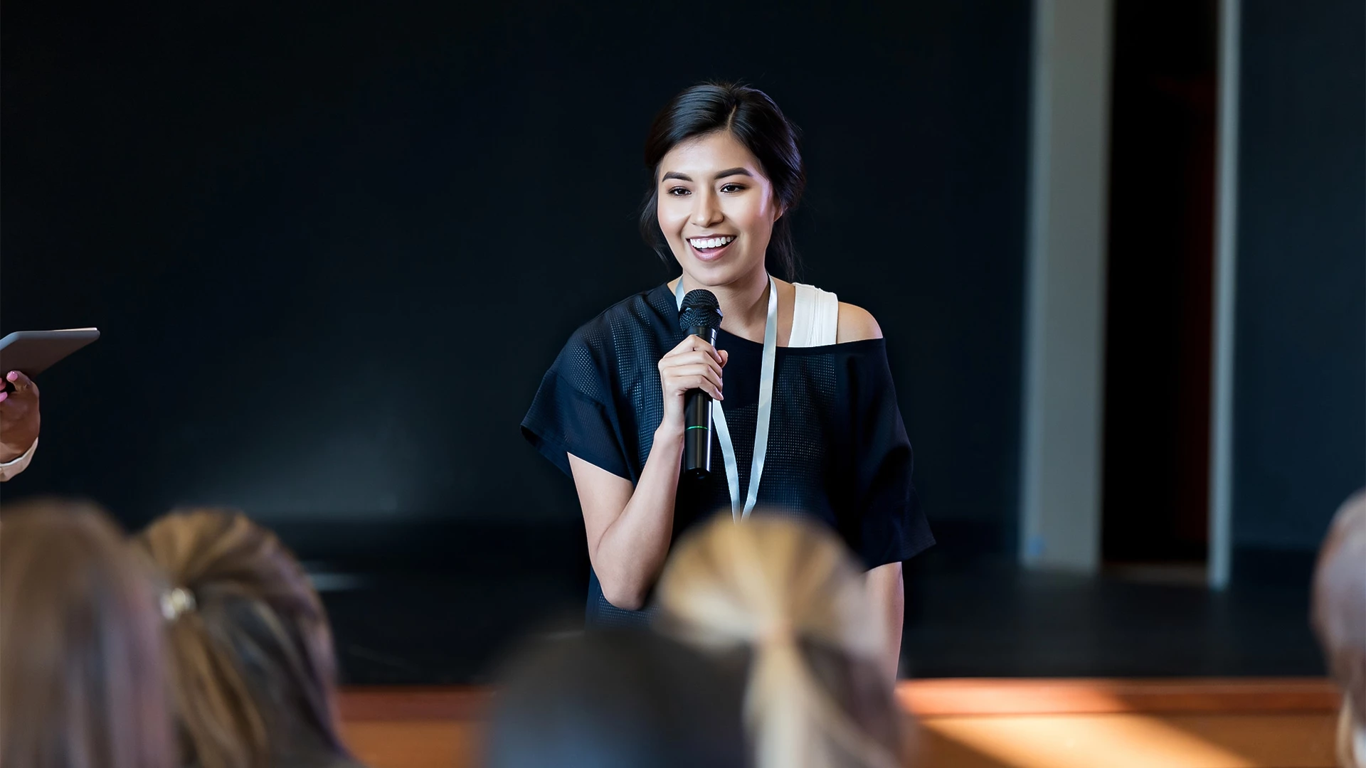 a woman holding a microphone