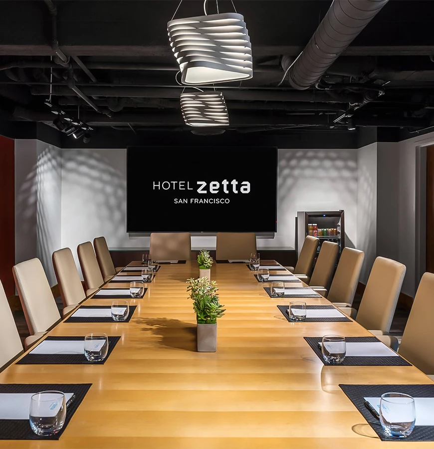 a conference room with a large table and chairs