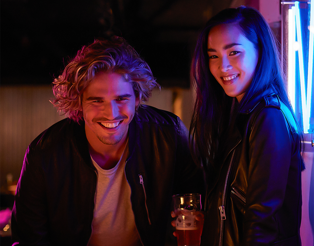a man and woman smiling at camera