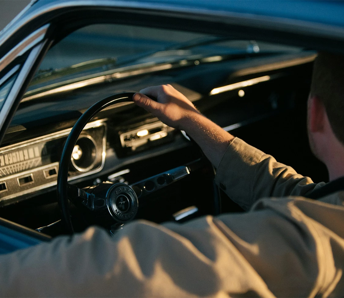 a man driving a car