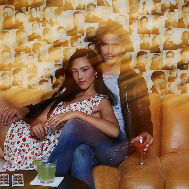 a man and woman sitting on a couch