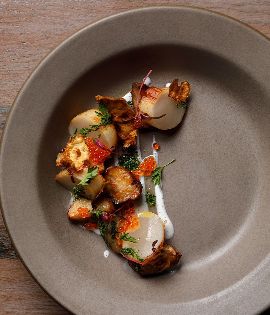 a plate of food on a wood table