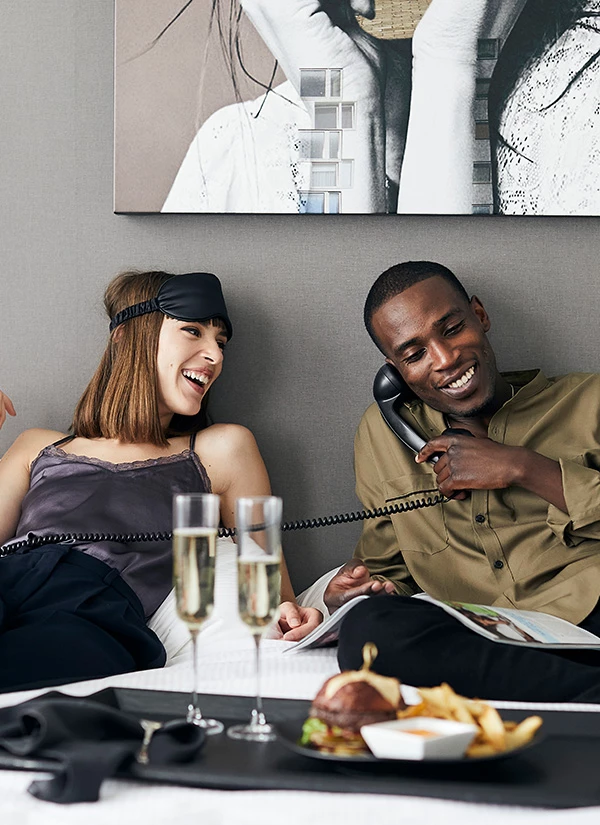 a man and woman on the phone