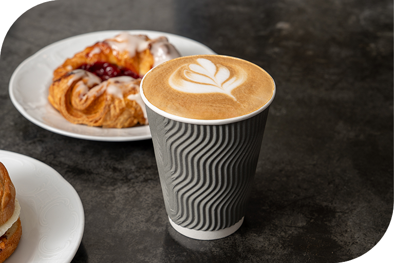 a cup of coffee and a pastry