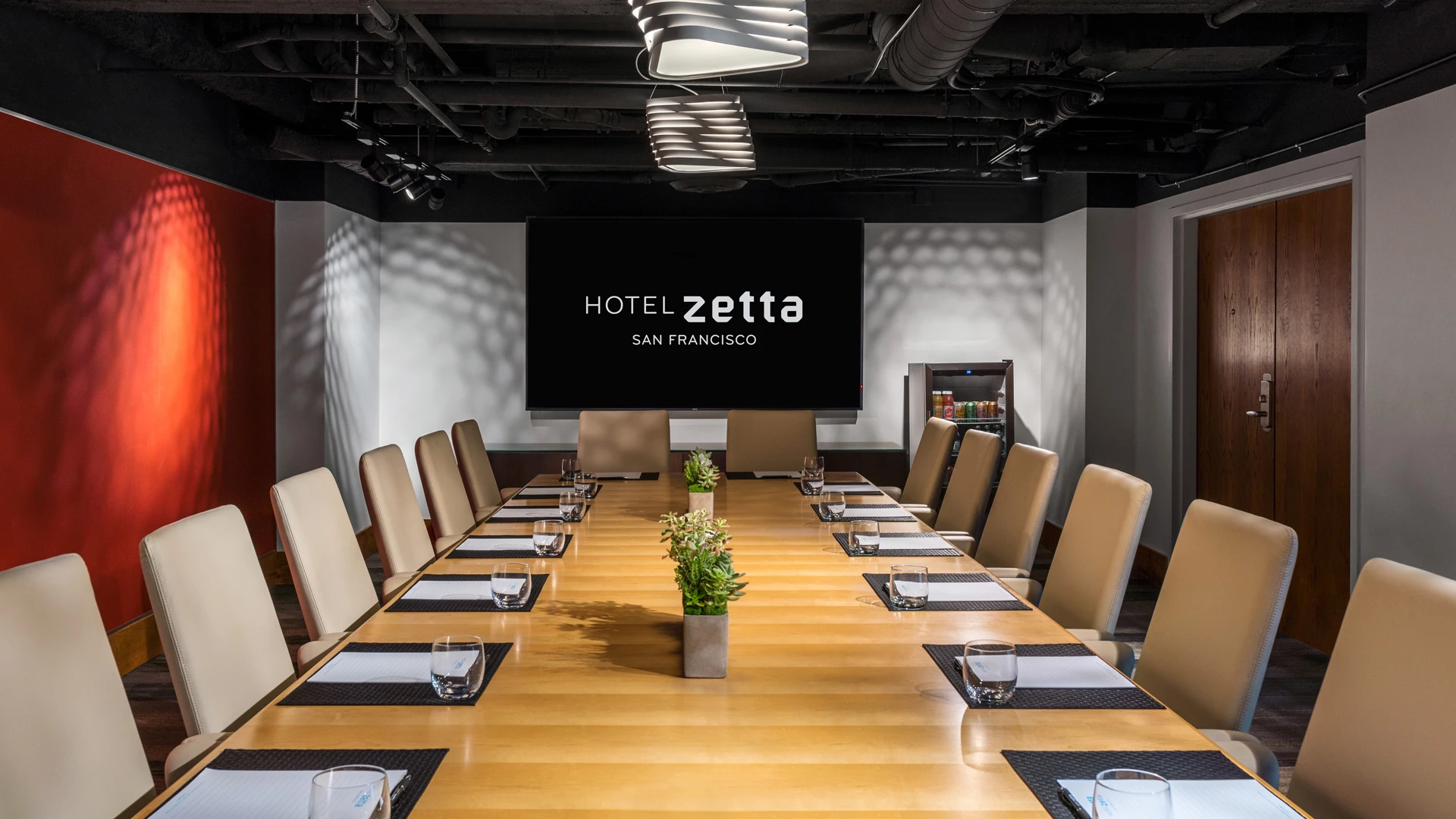 a conference room with a large screen