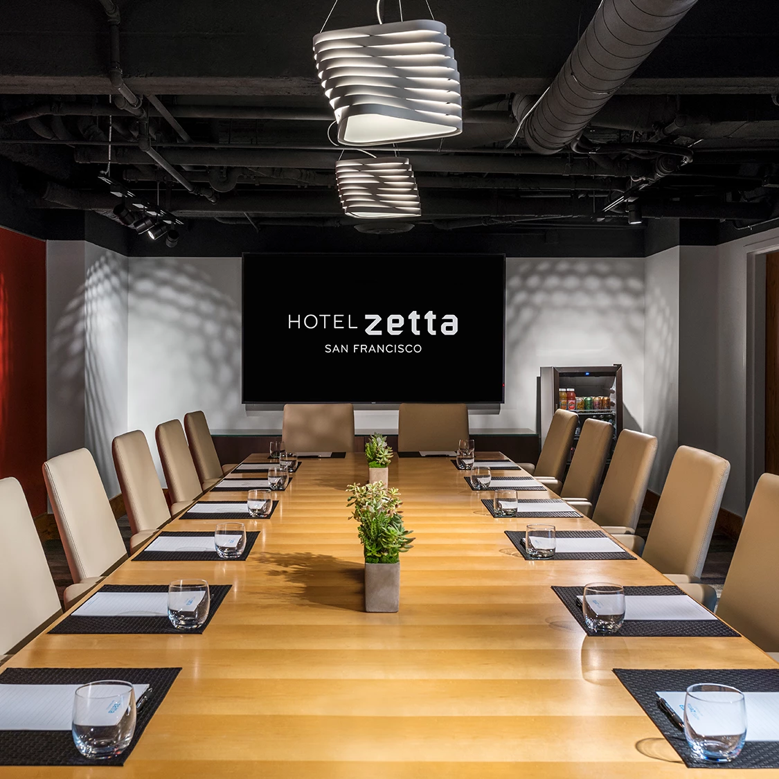 a conference room with a table and chairs