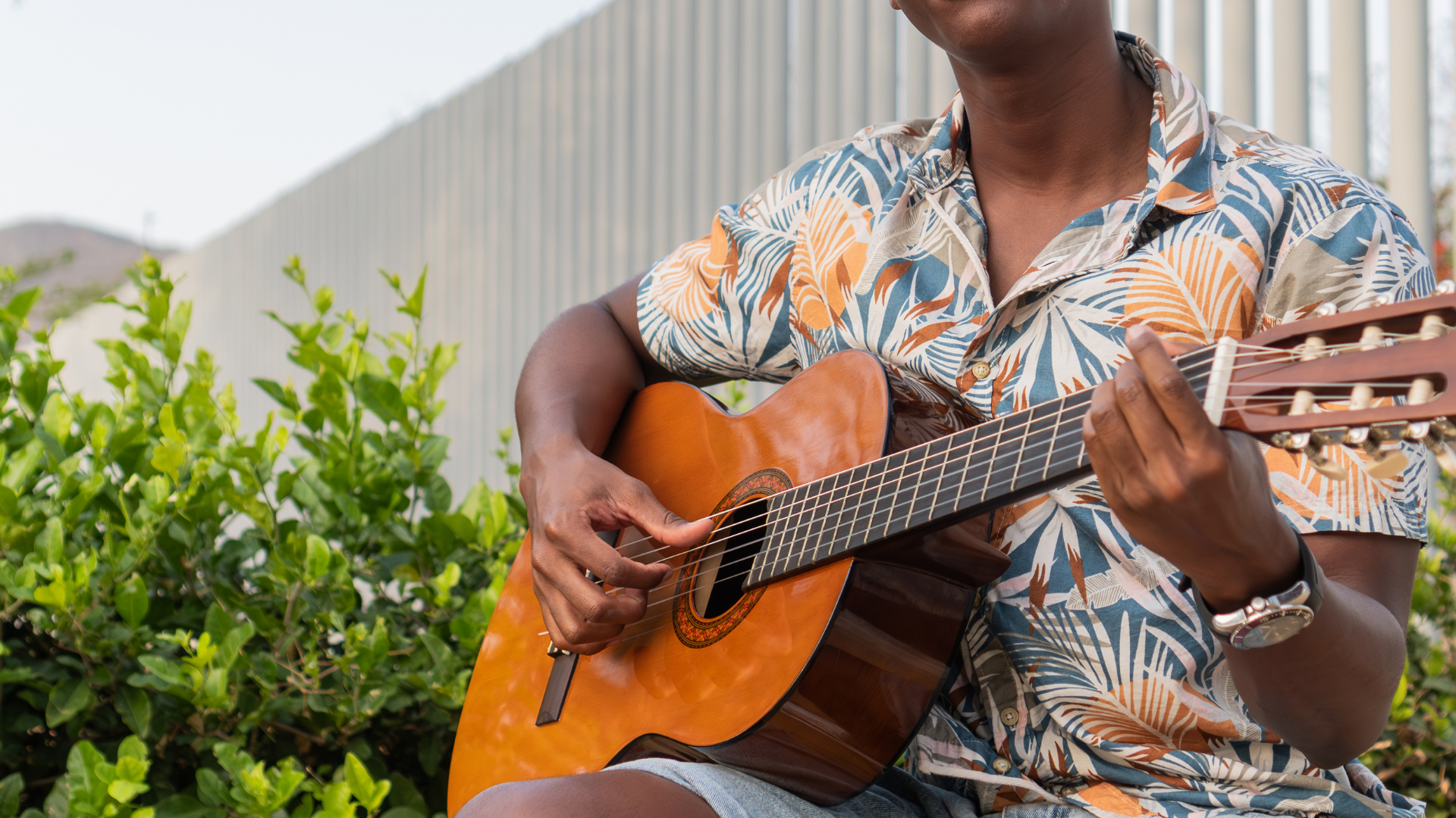 a person playing a guitar