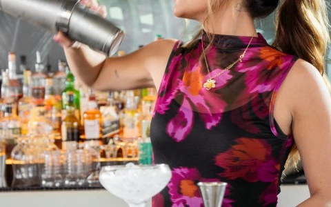 a woman holding a shaker