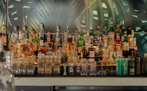 a group of bottles of alcohol on a counter