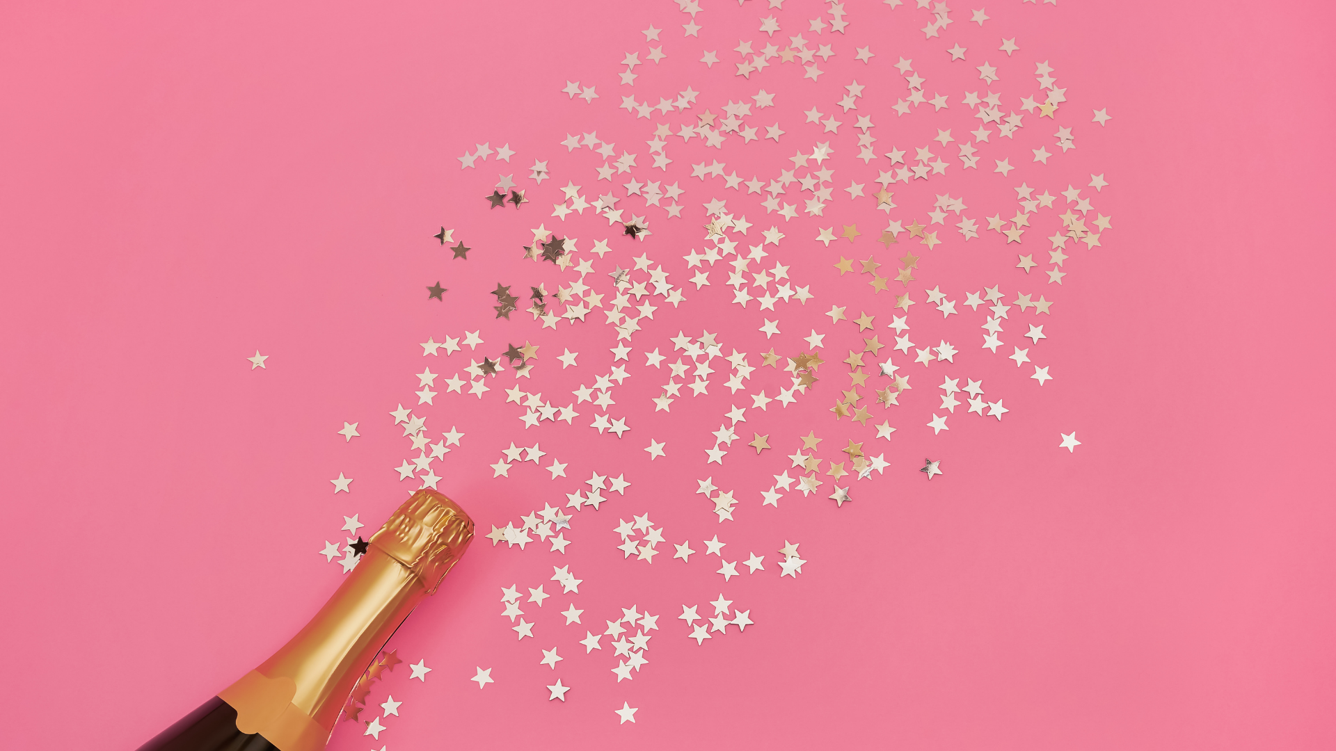 a bottle of champagne with stars on it