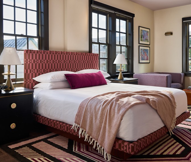 a bedroom with a bed and a couch