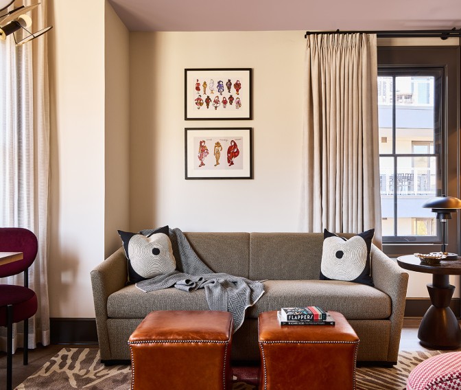 a living room with a couch and ottoman