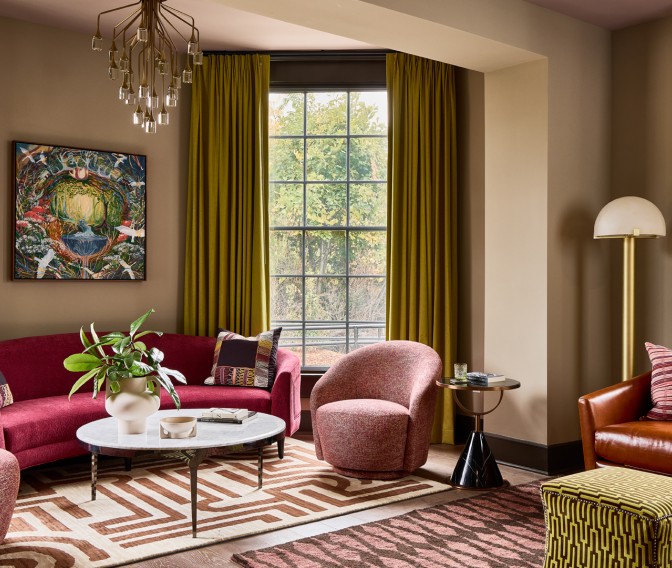 a living room with a couch and chairs