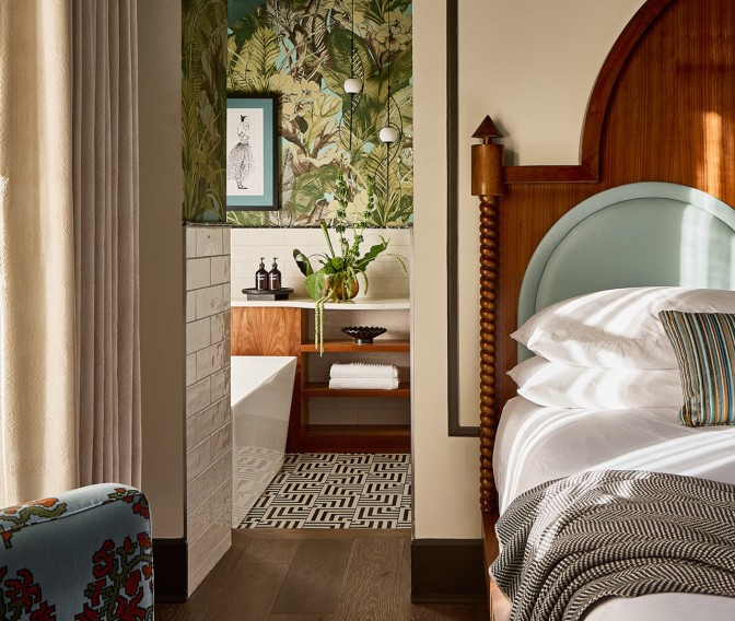 a bedroom with a bed and a bathtub