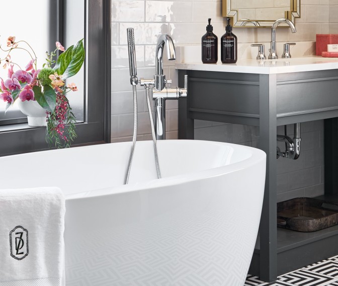 a bathroom with a tub and sink