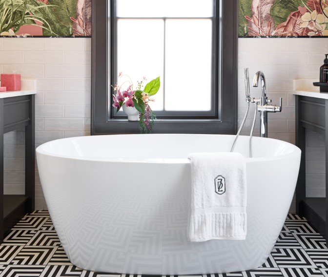 a white bathtub in a bathroom