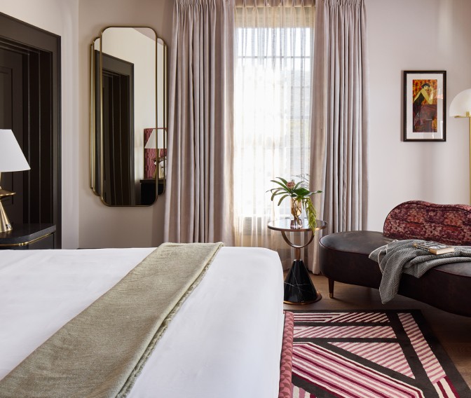 a room with a bed and a chair