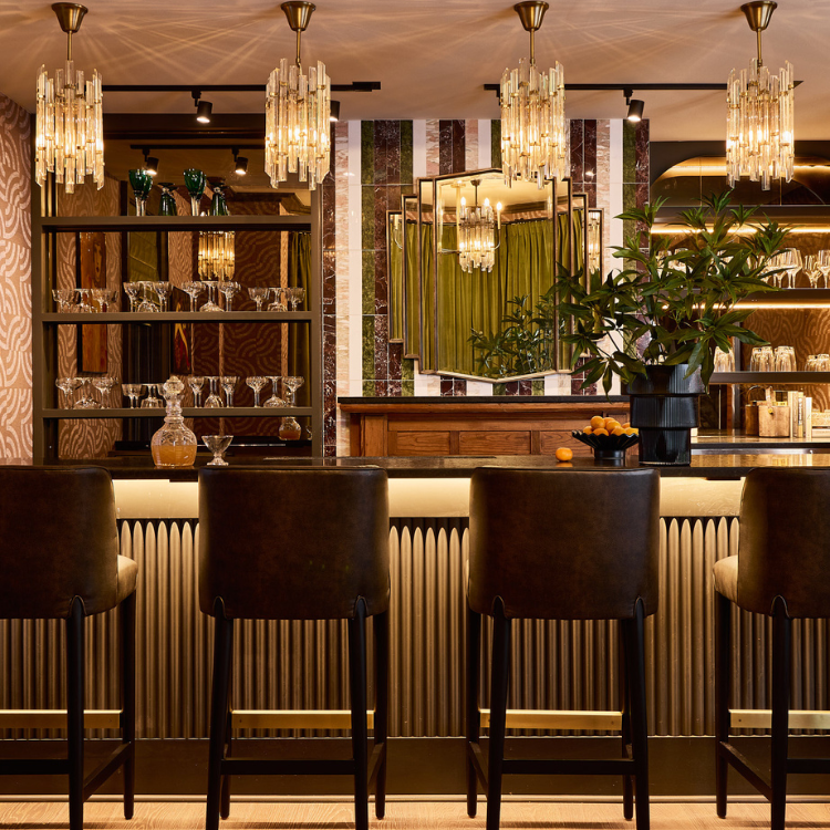 a bar with chairs and a mirror