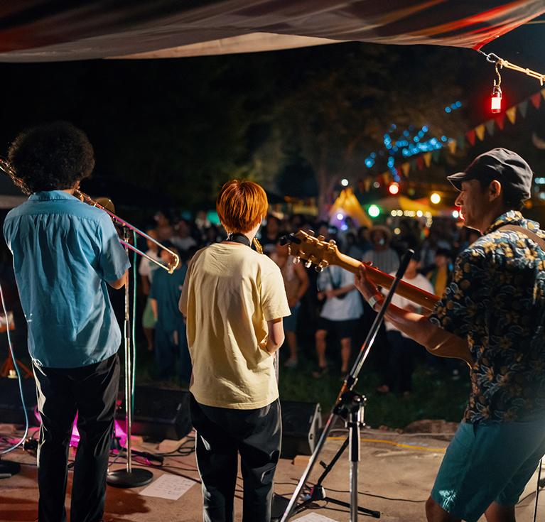 a group of people playing instruments on a stage