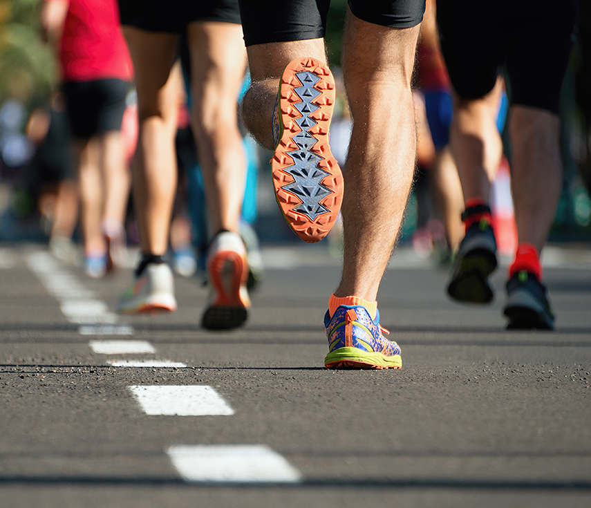 a group of people running on a road