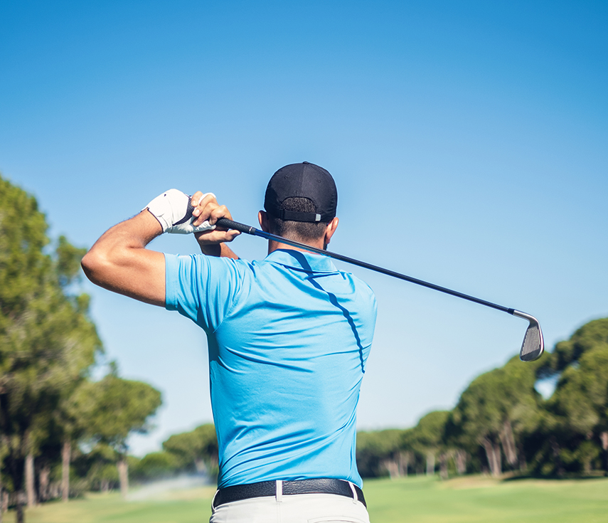 a man swinging a golf club