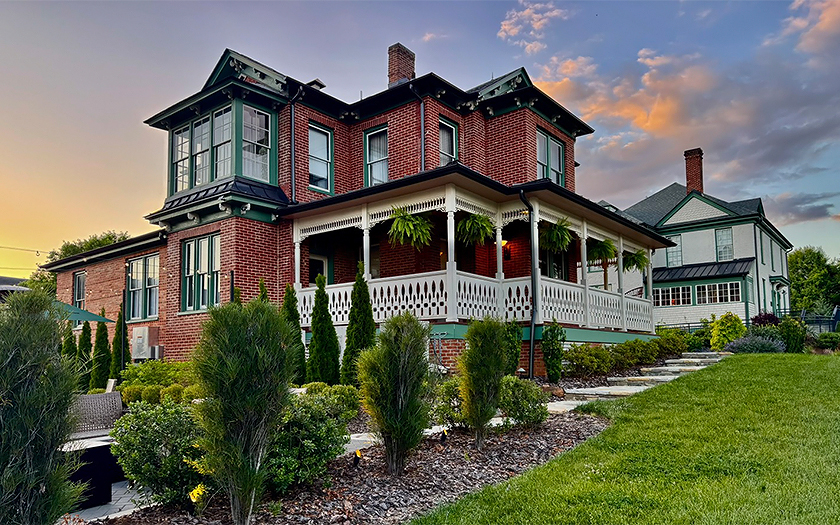 a house with a porch and a lawn