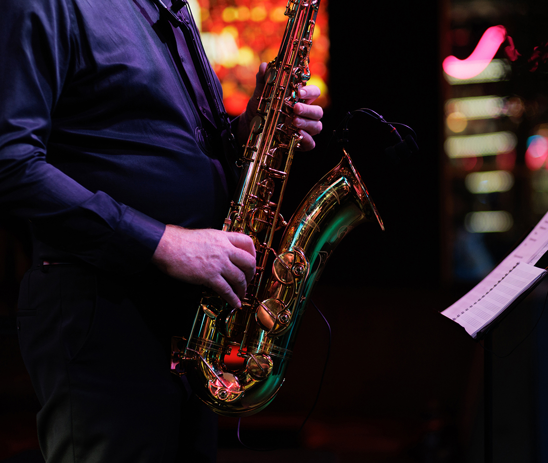 a man playing a saxophone