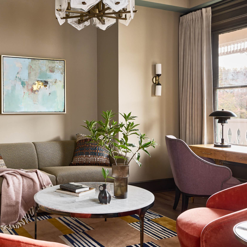 a living room with a couch and chairs