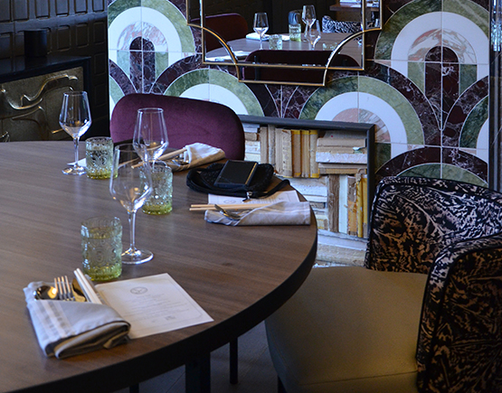 a table with glasses and napkins on it