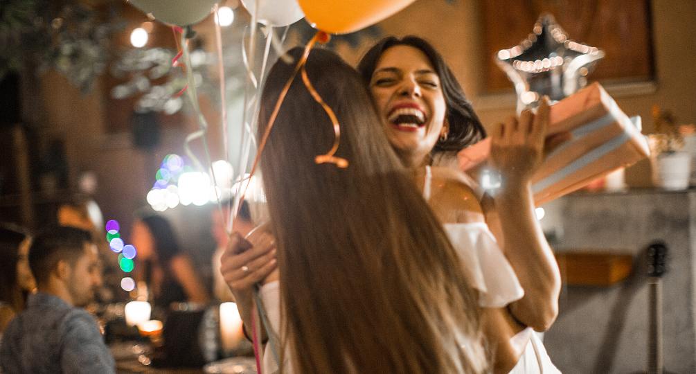 two women hugging each other