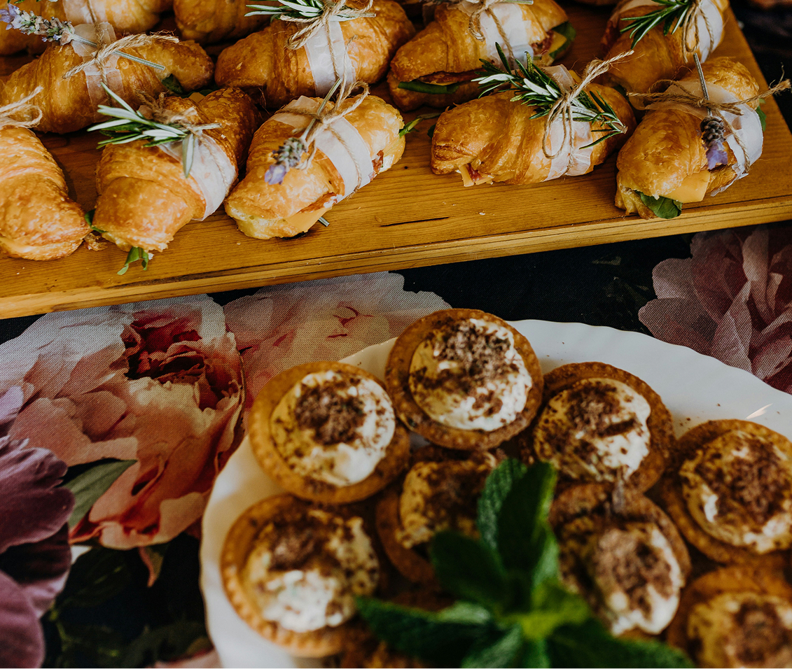 a tray of pastries and pastries on a table