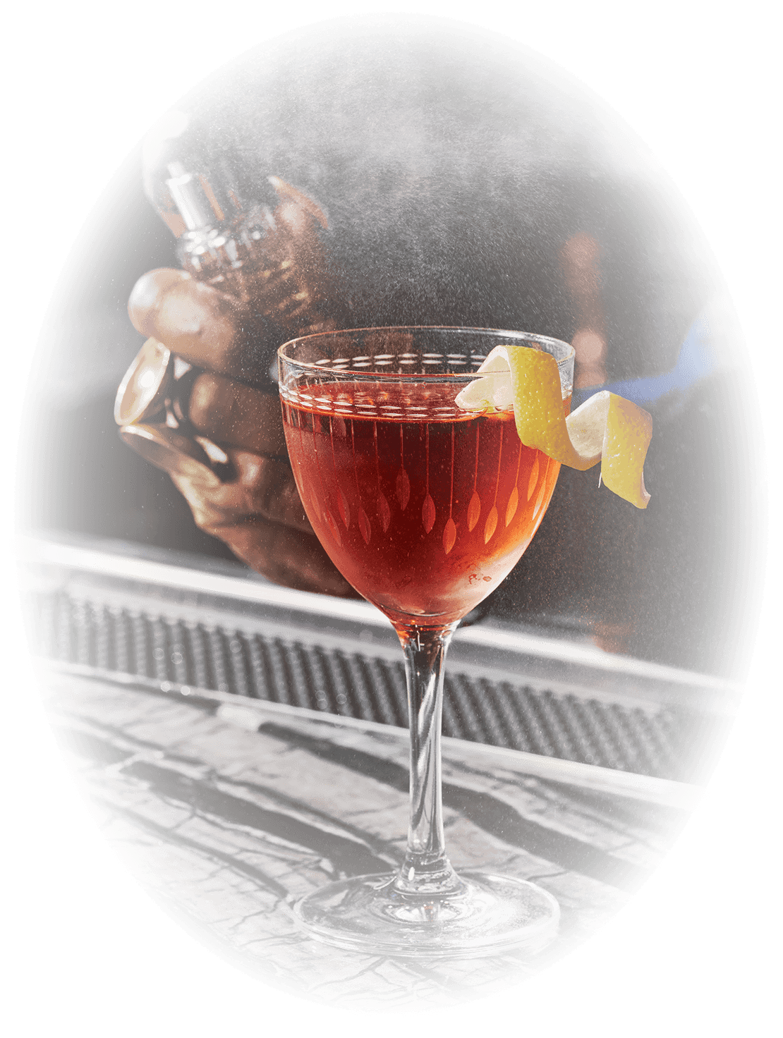 a glass with a drink and a lemon wedge