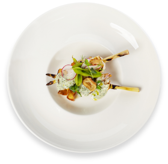 a plate of food on a black background